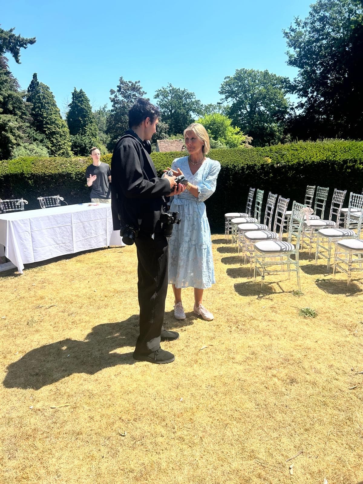Jane talking with the photographer before a ceremony