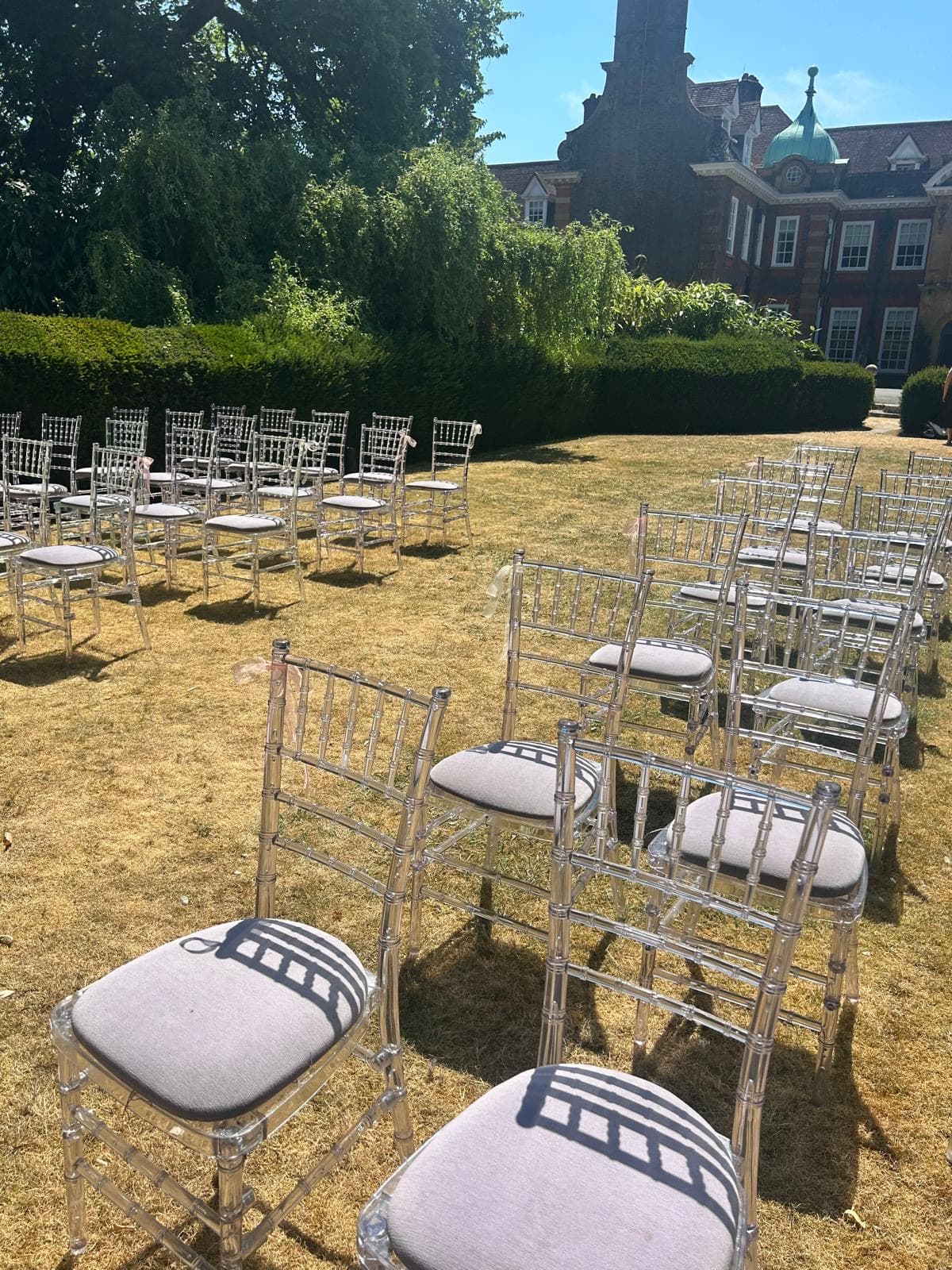 Chairs set out on the lawn for an outdoor ceremony
